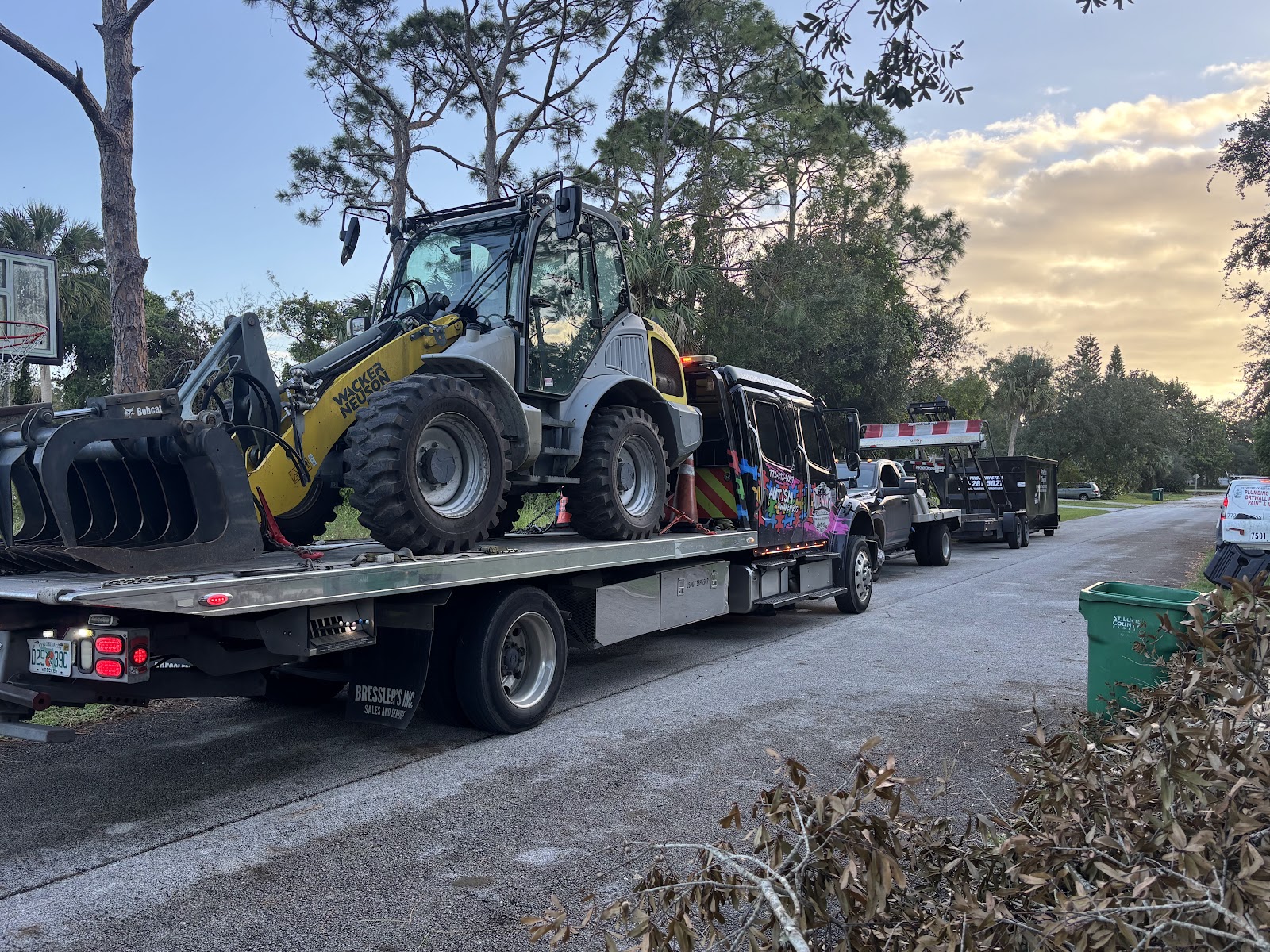 AllWays Reliable Towing rollback transporting heavy equipment Fort Pierce FL
